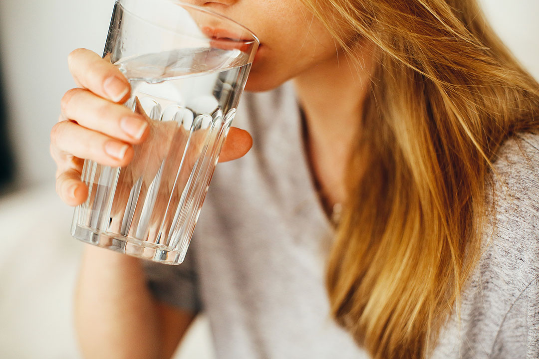 woman drinking water - crowding out